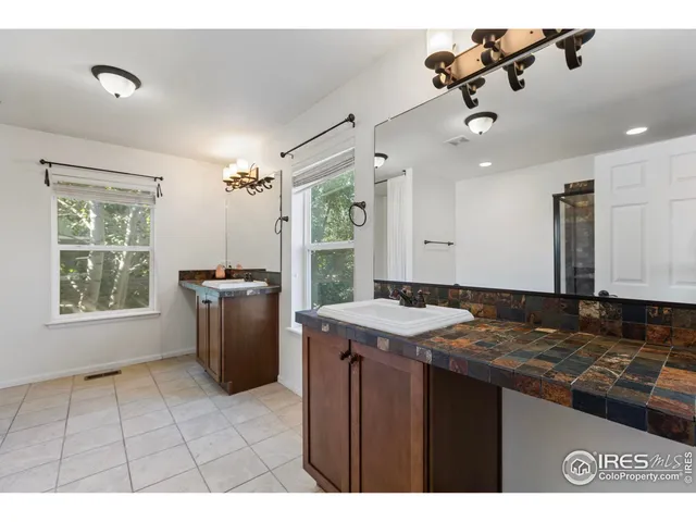 a view of a kitchen with a sink and a window