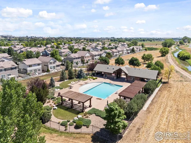a terrace with outdoor seating and city view