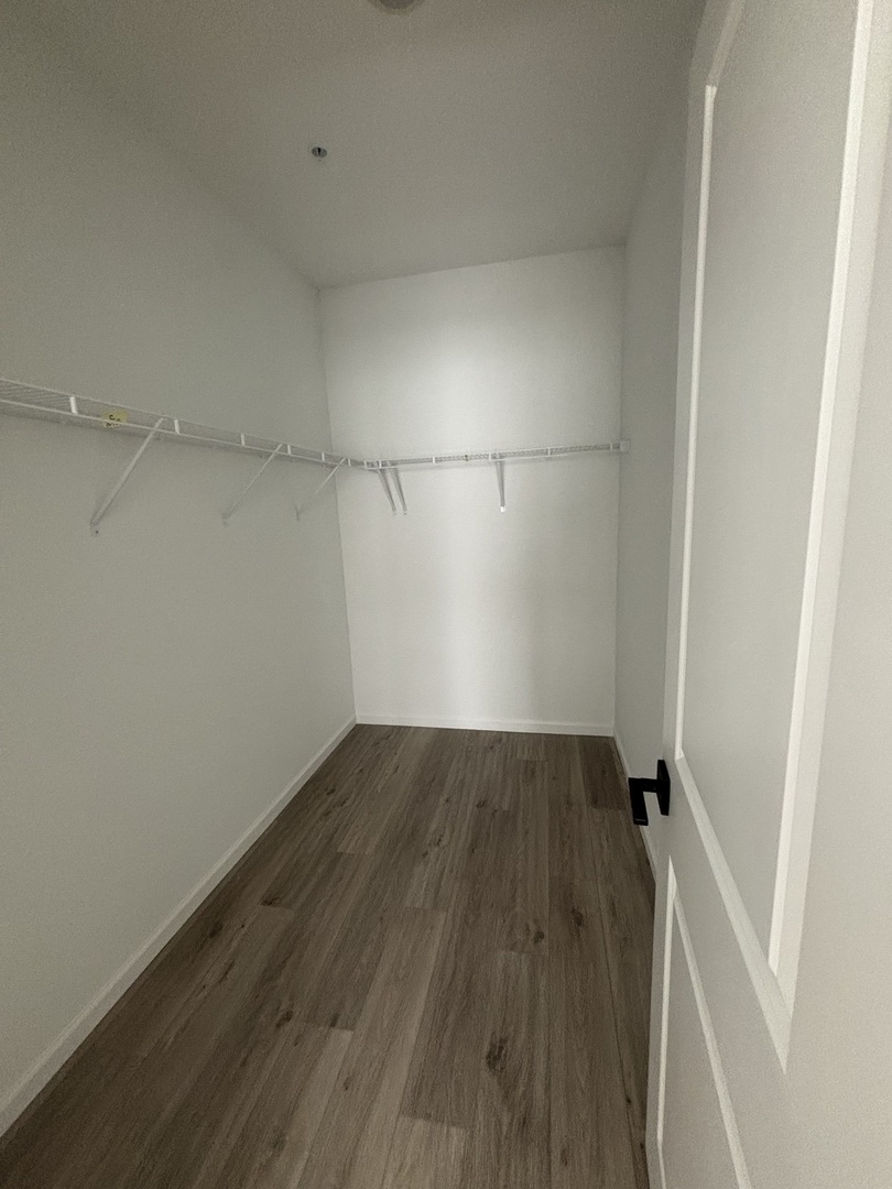 30 South 14th Street, Unit E St. Charles, IL 60174 - Photo 9 of 10 a view of a room with wooden floor and window