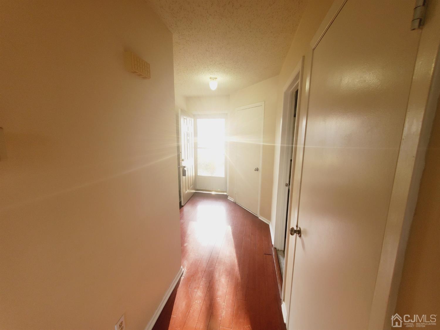 148 Nebula Road Piscataway, NJ 08854 - Photo 2 of 22 a view of a hallway with wooden floor