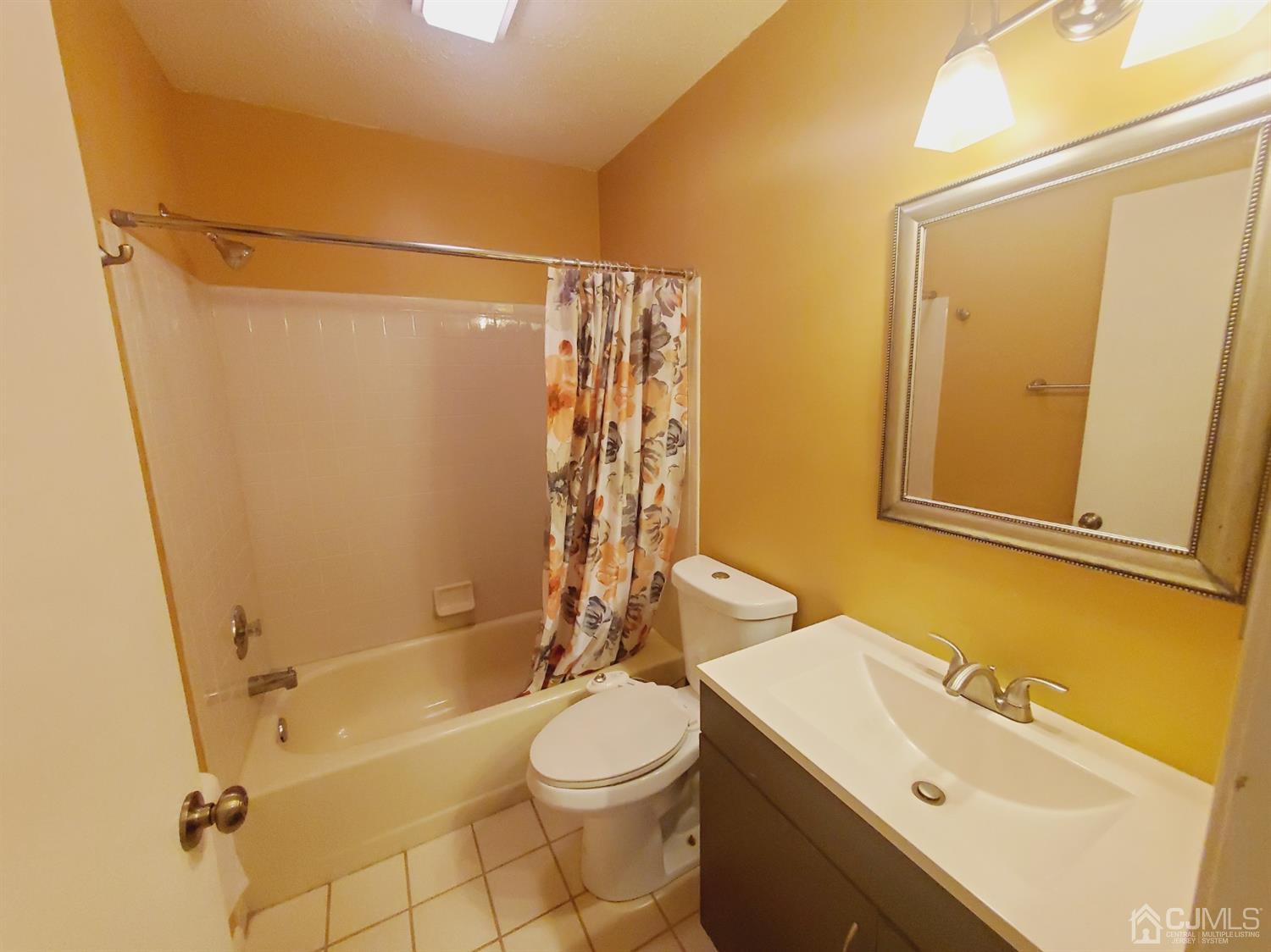 148 Nebula Road Piscataway, NJ 08854 - Photo 13 of 22 a bathroom with a sink a toilet and shower