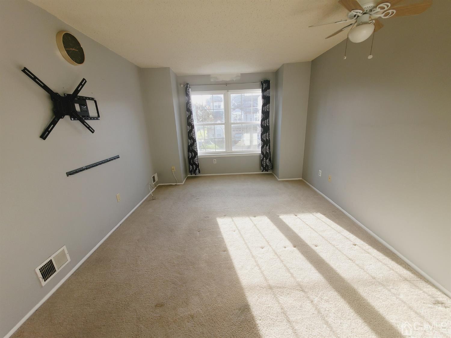 148 Nebula Road Piscataway, NJ 08854 - Photo 15 of 22 a view of a room with a ceiling fan and window