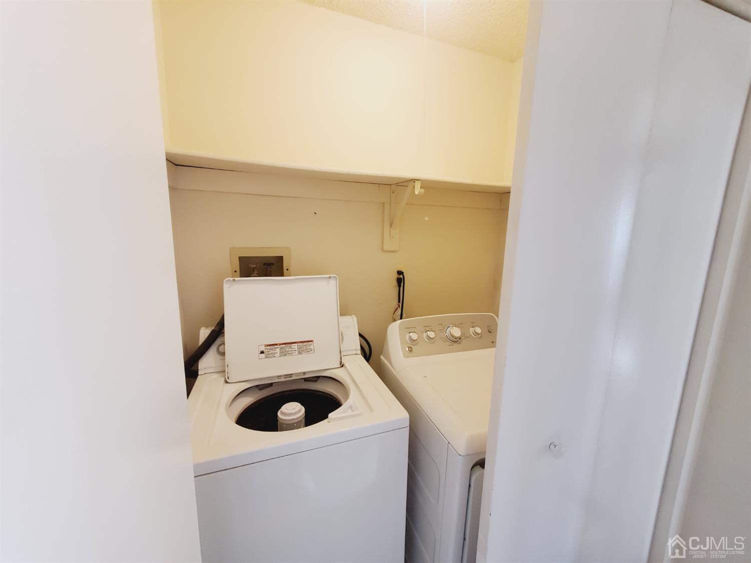 148 Nebula Road Piscataway, NJ 08854 - Photo 18 of 22 a utility room with dryer and washer