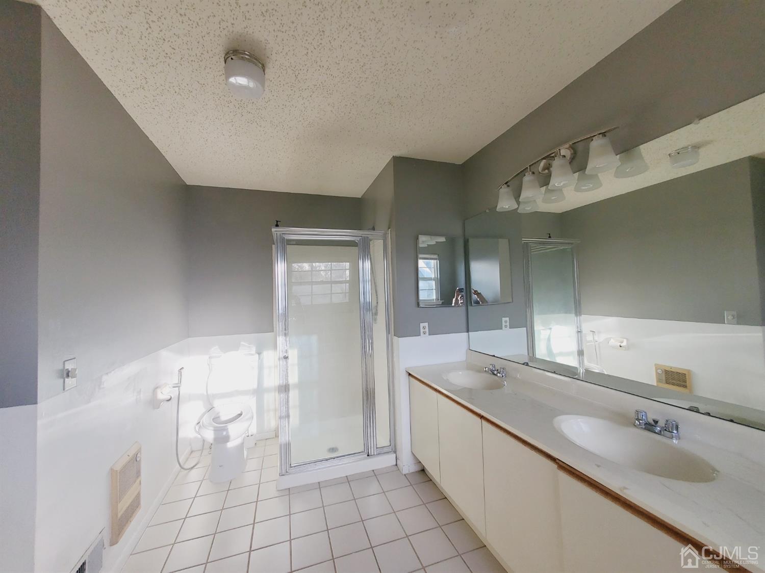 148 Nebula Road Piscataway, NJ 08854 - Photo 20 of 22 a large bathroom with a double vanity sink a mirror and a bathtub