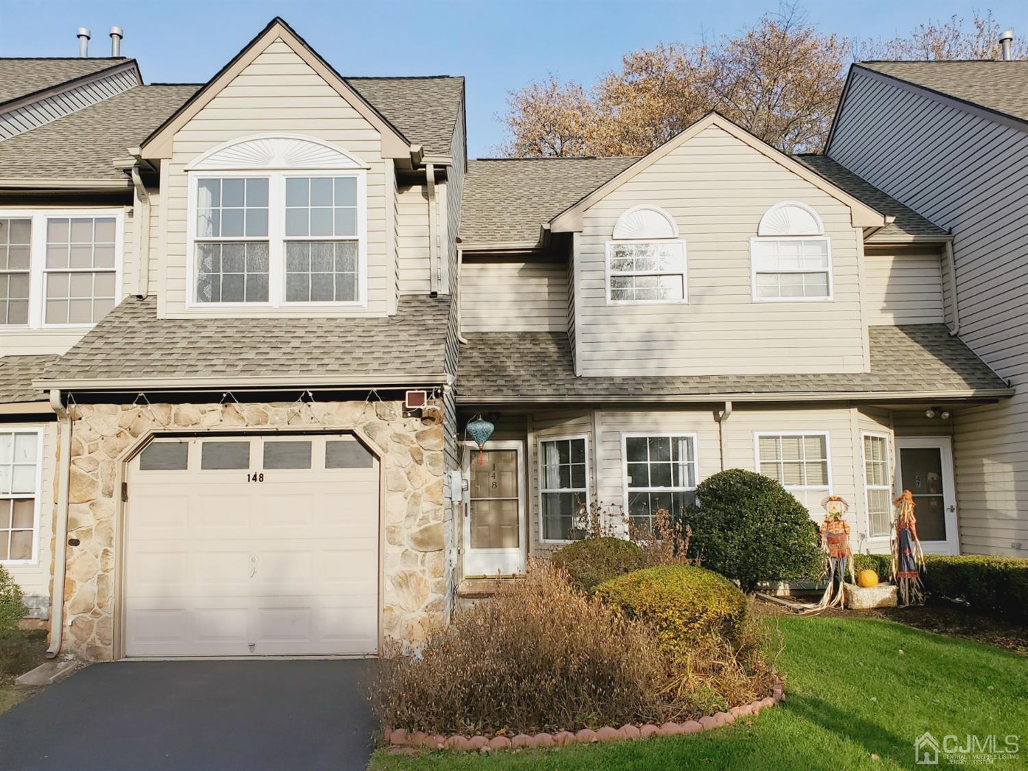148 Nebula Road Piscataway, NJ 08854 - Photo 3 of 22 a front view of a house with a yard and garage