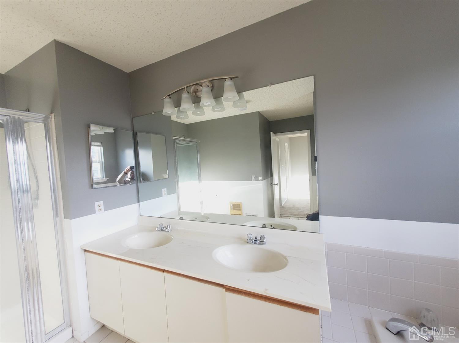 148 Nebula Road Piscataway, NJ 08854 - Photo 21 of 22 a bathroom with a sink and a mirror