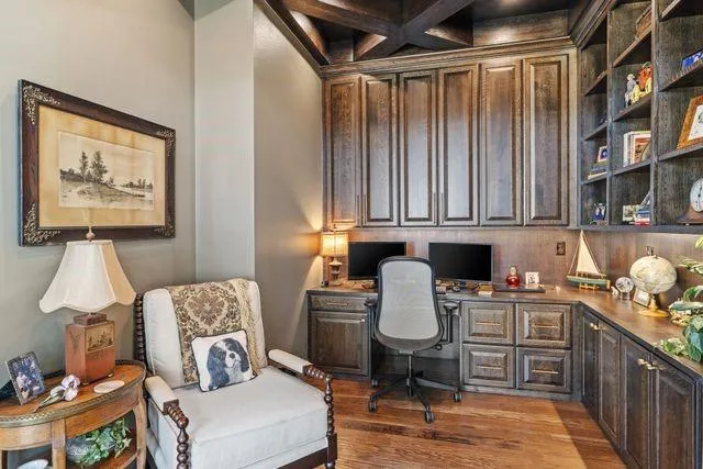 a kitchen with a sink window and cabinets