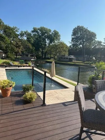 a view of a balcony with potted plants