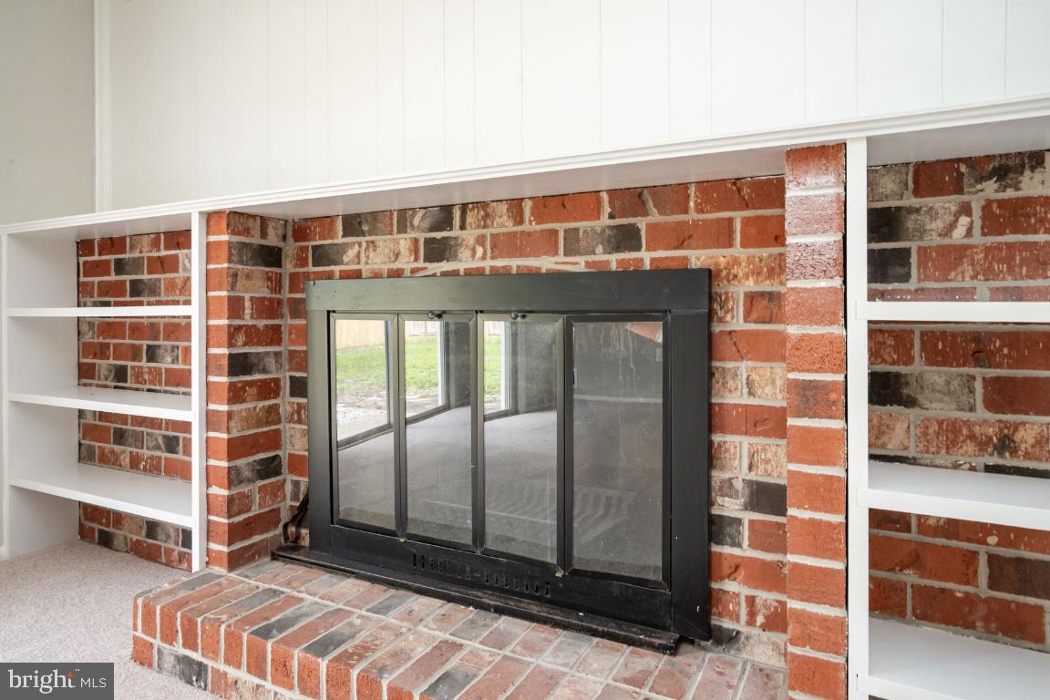 6017 Suzanne Road Waldorf, MD 20601 - Photo 14 of 31 Wood burning fireplace with built-in shelves.
