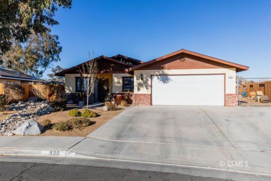 620 East Wilson Avenue Ridgecrest, CA 93555 - Photo 1 of 30 a front view of a house with a yard