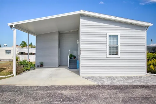 a view of a house with a yard and garage