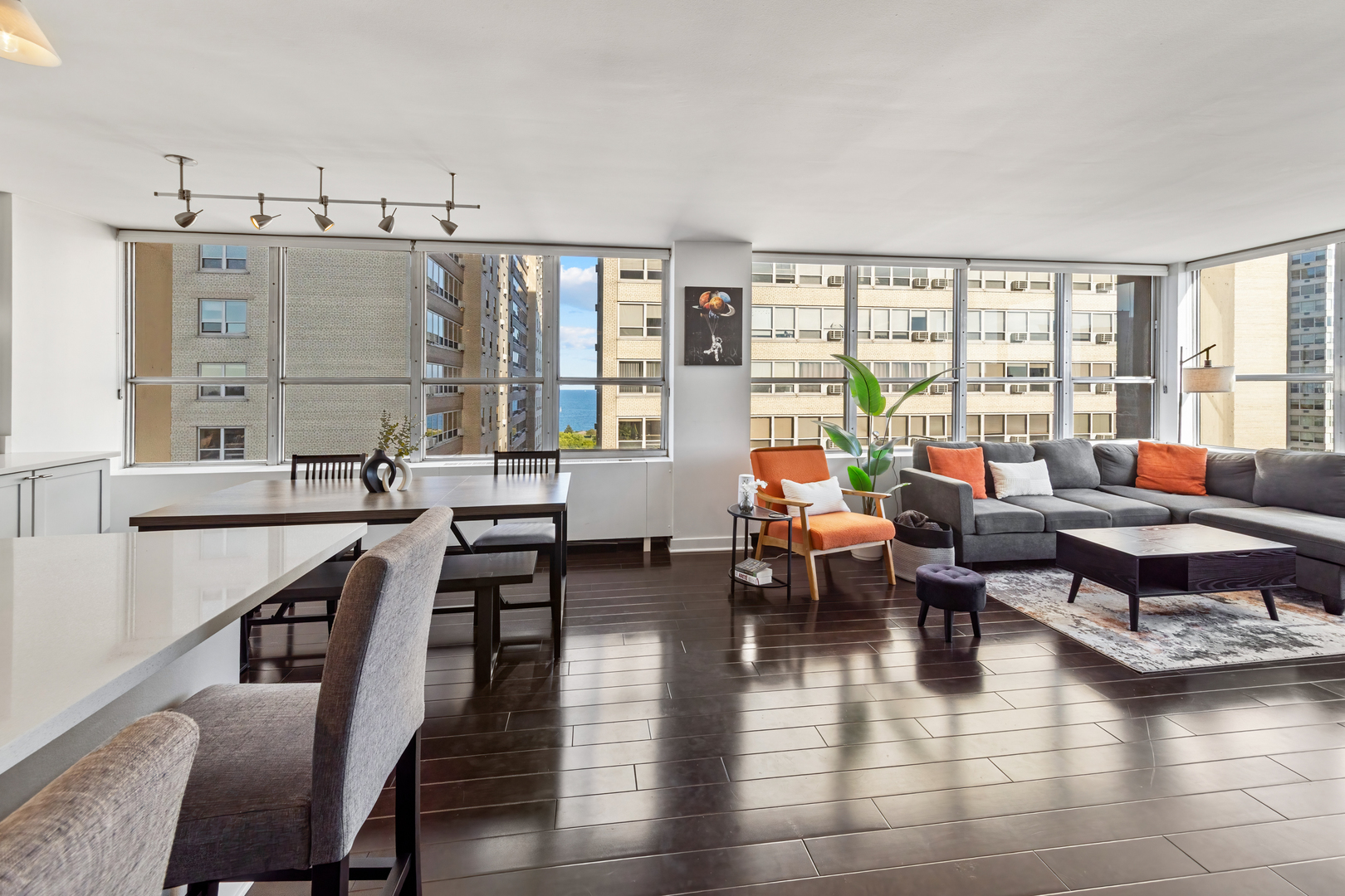 655 West Irving Park Road, Unit 1301 Chicago, IL 60613 - Photo 11 of 22 a living room with furniture and floor to ceiling windows