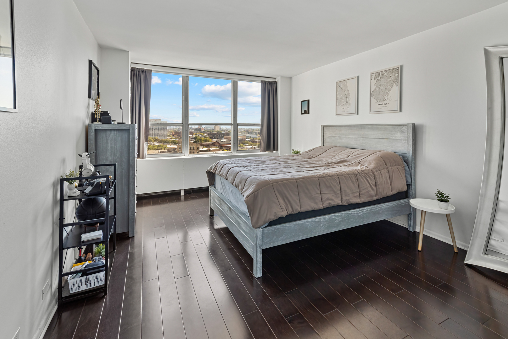 655 West Irving Park Road, Unit 1301 Chicago, IL 60613 - Photo 12 of 22 a bed sitting in a bedroom next to a window