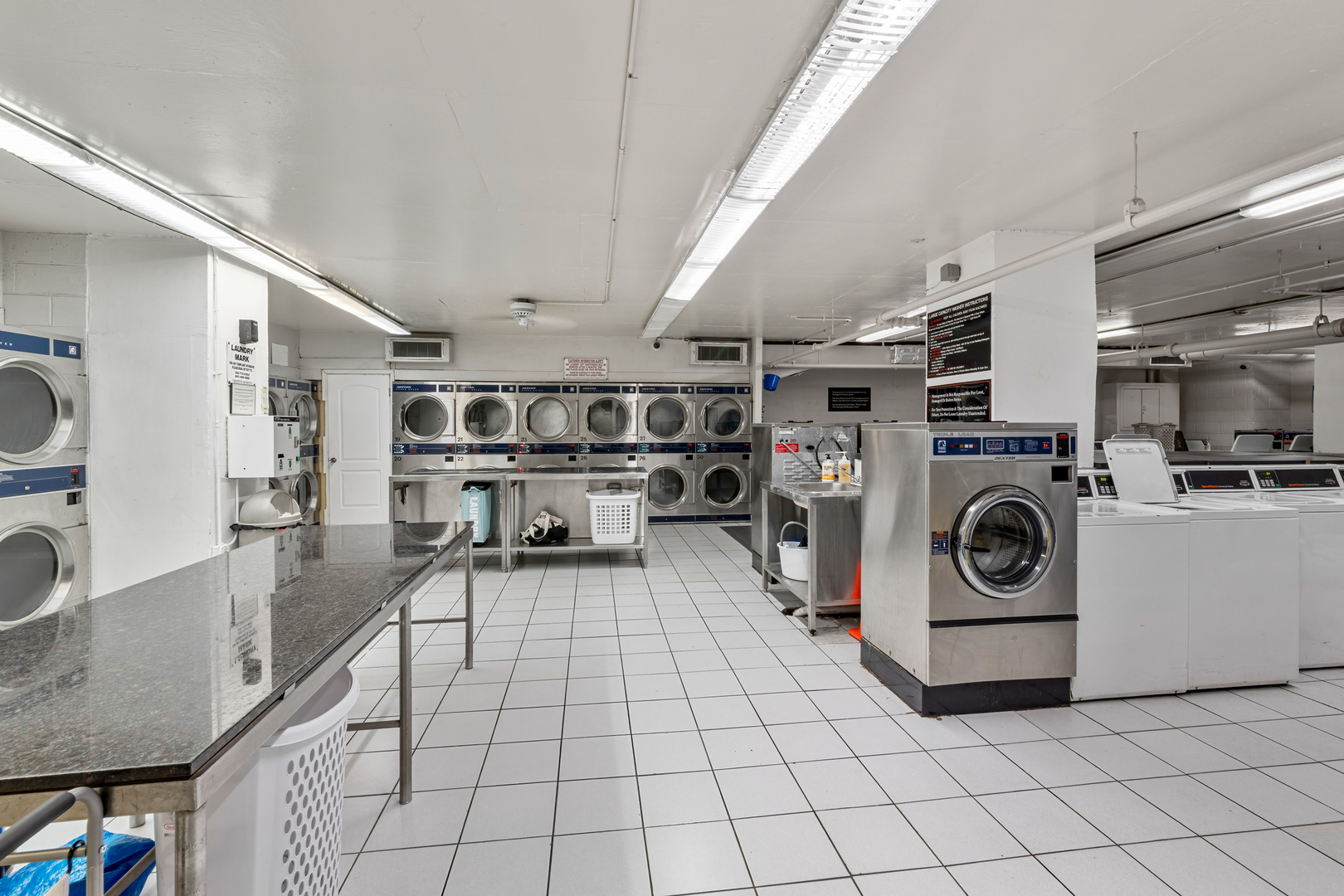 655 West Irving Park Road, Unit 1301 Chicago, IL 60613 - Photo 18 of 22 a utility room with dryer and washer