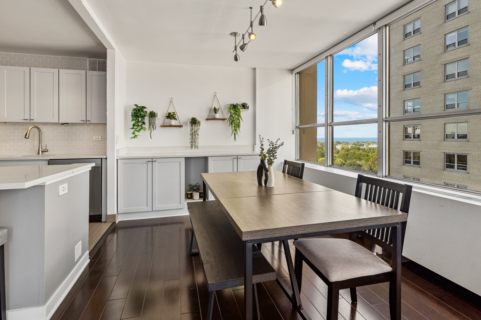 655 West Irving Park Road, Unit 1301 Chicago, IL 60613 - Photo 8 of 22 a view of a dining room with furniture and window