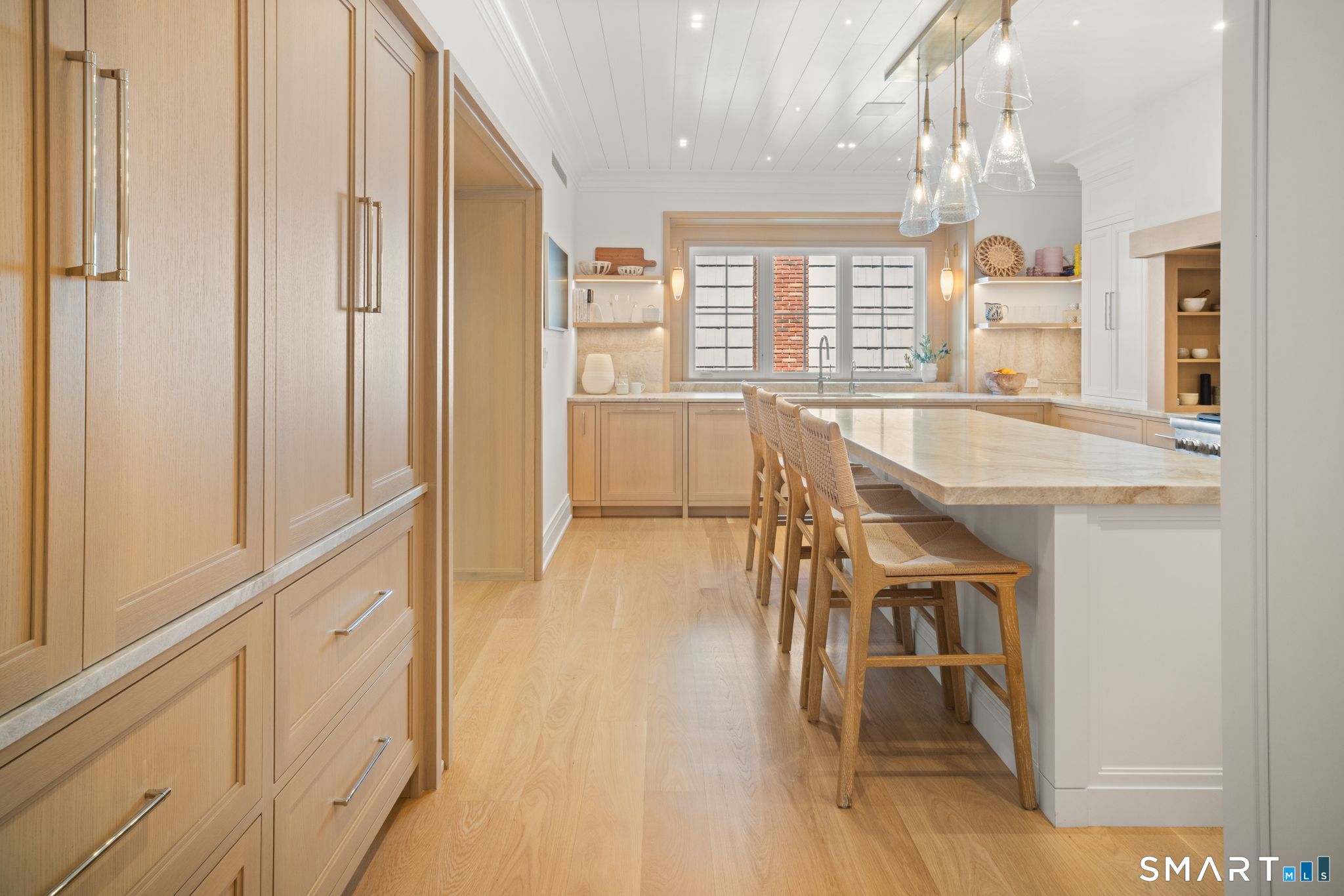 69 Birch Road Fairfield, CT 06824 - Photo 9 of 40 a view of a dining room with furniture window and wooden floor