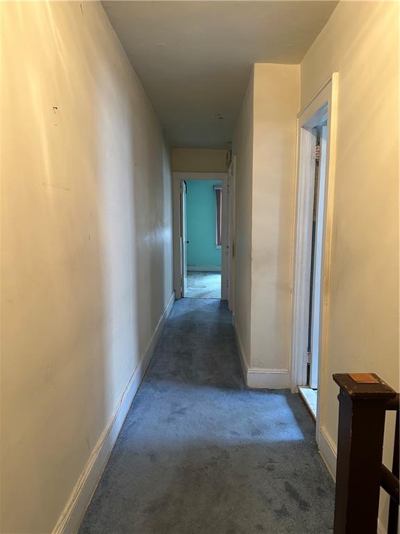 981 78th Street Brooklyn, NY 11228 - Photo 6 of 9 a view of a hallway with wooden floor