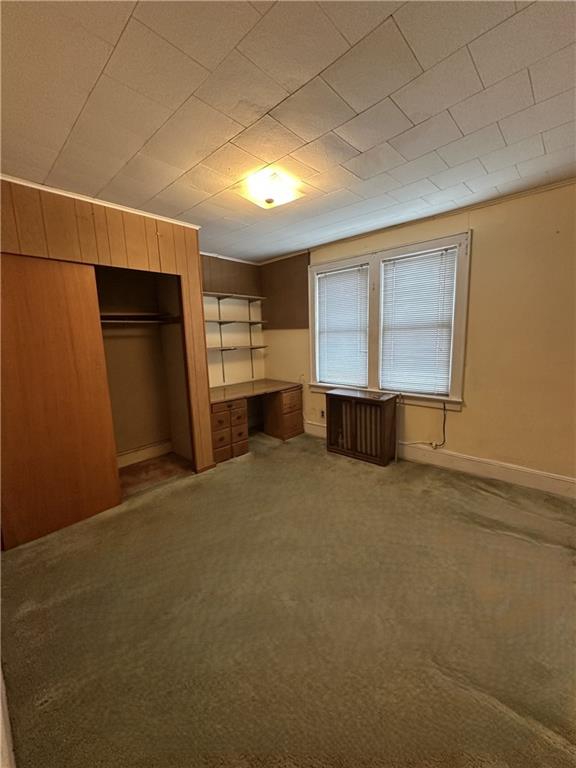 981 78th Street Brooklyn, NY 11228 - Photo 7 of 9 a view of an empty room with a fireplace and a window