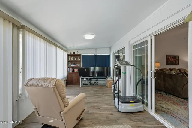 a view of a house with a yard and pathway