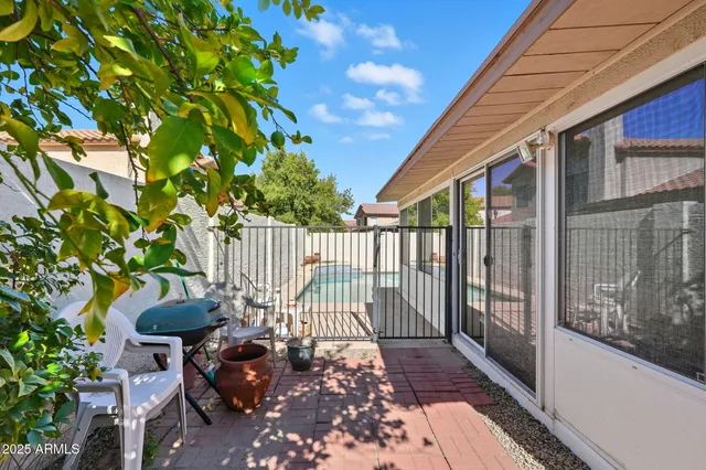a front view of a house with a garden and yard