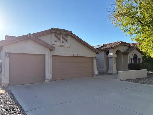 a view of garage and yard