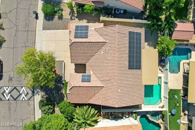 a view of a swimming pool with a yard
