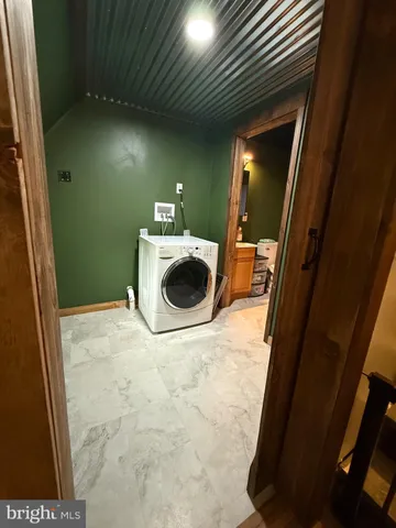 a view of livingroom with furniture and stairs