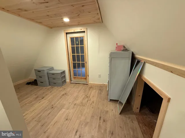 a view of a backyard with potted plants