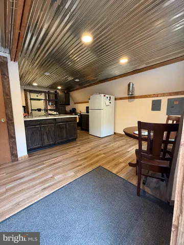a kitchen with kitchen island a sink stainless steel appliances and cabinets