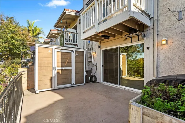 a front view of a building with a garden