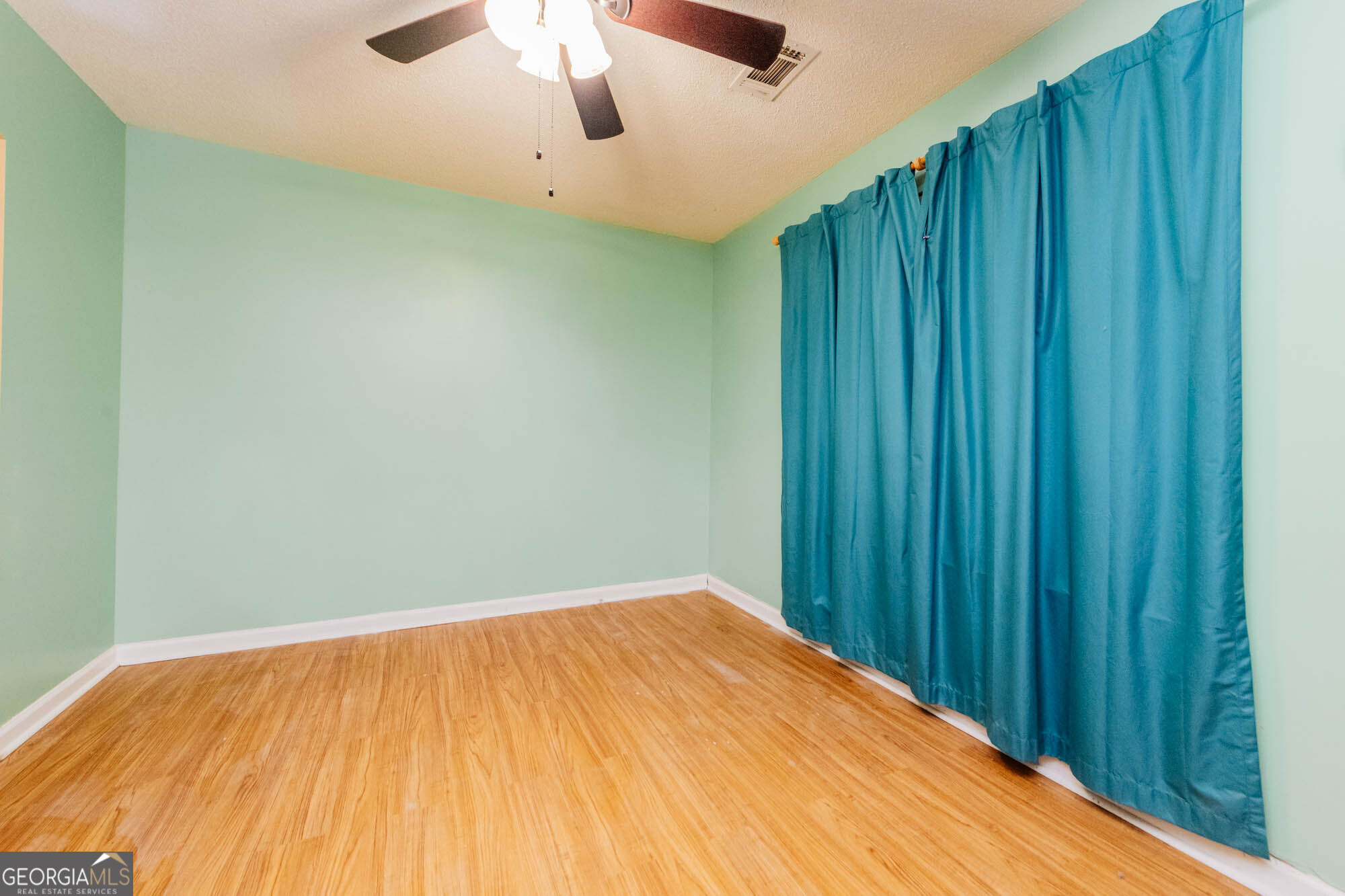 525 Hardison Church Road Byron, GA 31008 - Photo 18 of 32 a view of a room with a wooden wall