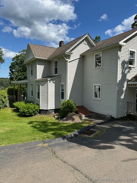 215 Sherman Avenue Hamden, CT 06518 - Photo 2 of 12 a front view of a house with a yard