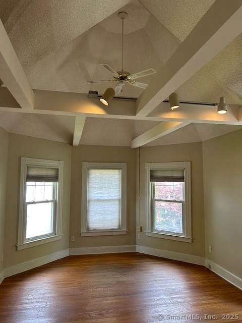 215 Sherman Avenue Hamden, CT 06518 - Photo 5 of 12 an empty room with wooden floor chandelier fan and windows