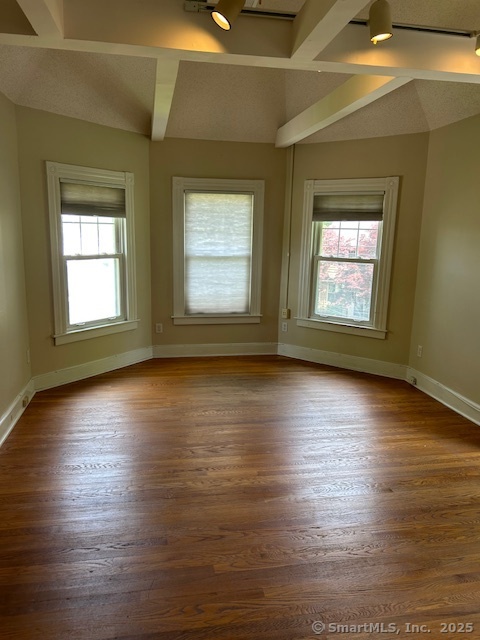 215 Sherman Avenue Hamden, CT 06518 - Photo 6 of 12 an empty room with wooden floor and windows