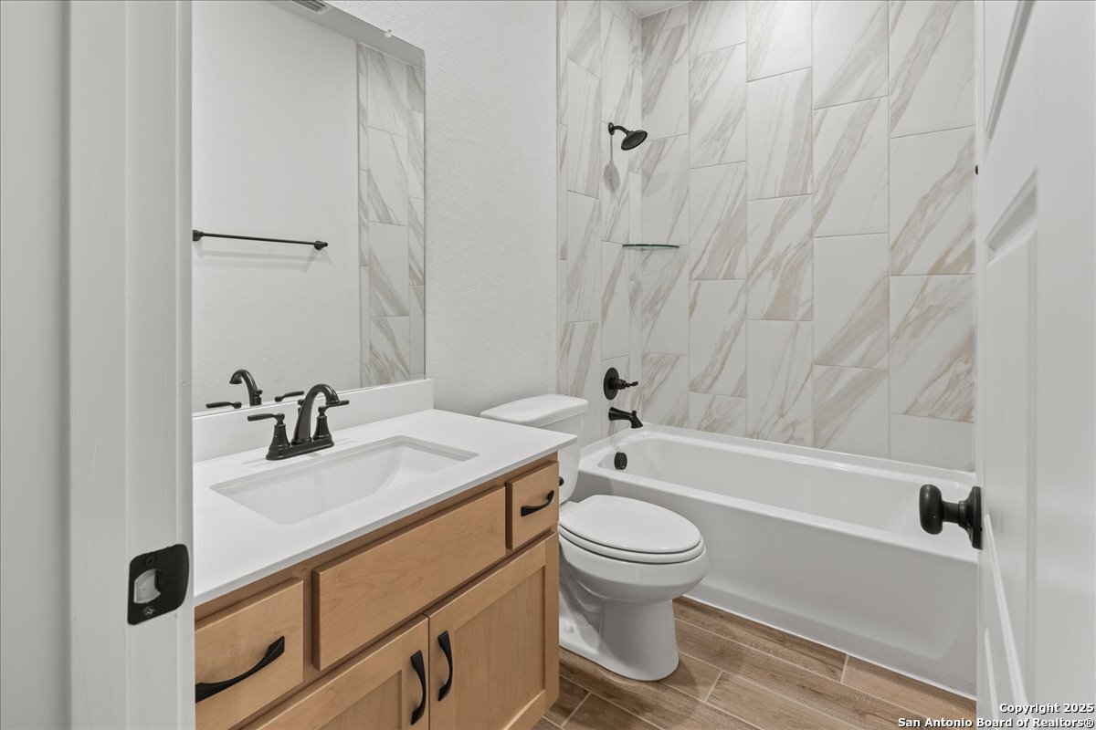 2009 Shepards Street Seguin, TX 78155 - Photo 11 of 22 a bathroom with a sink toilet and shower