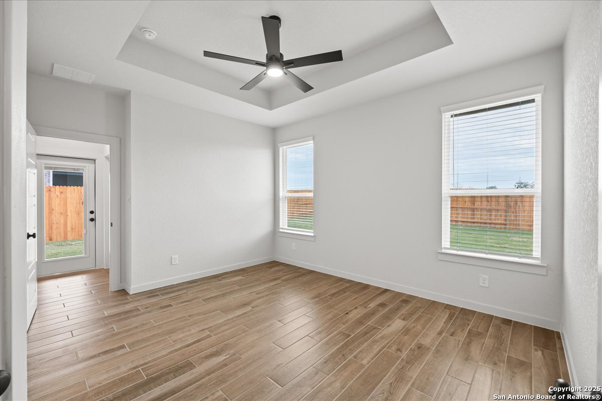 2009 Shepards Street Seguin, TX 78155 - Photo 12 of 22 wooden floor in an empty room with a window