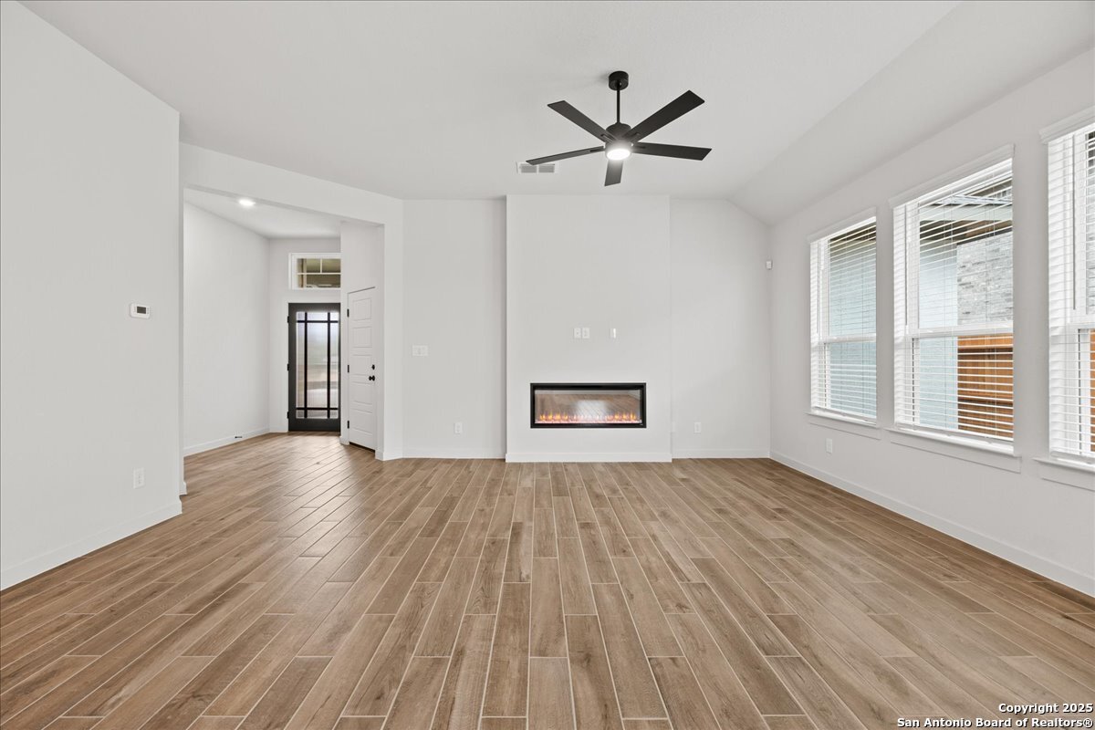 2009 Shepards Street Seguin, TX 78155 - Photo 3 of 22 a view of empty room with wooden floor and window