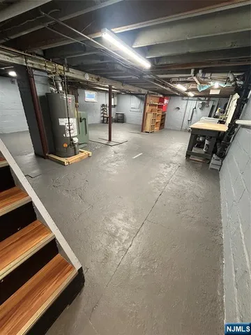 a view of empty room with wooden ceiling
