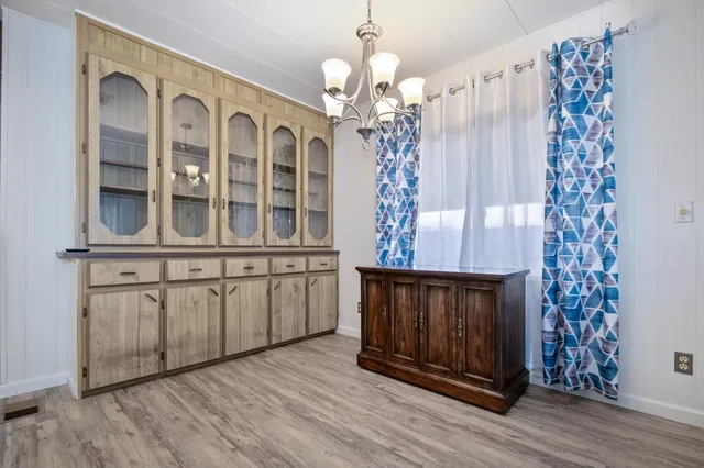 a view of a fireplace with wooden floor