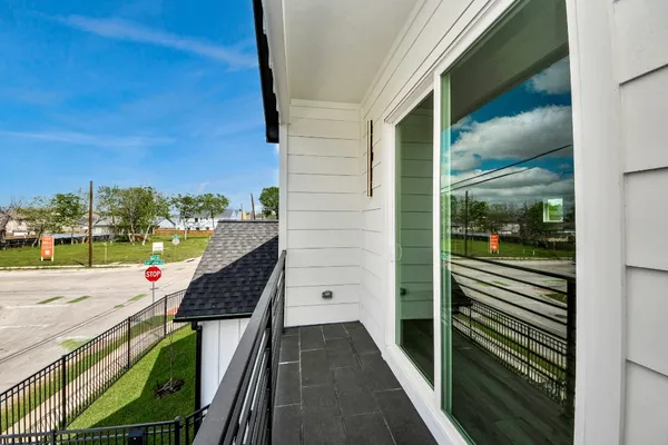 a view of a balcony with floor to ceiling window wooden floor and outdoor space