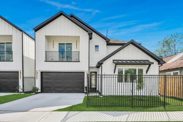 a front view of a house with a garage