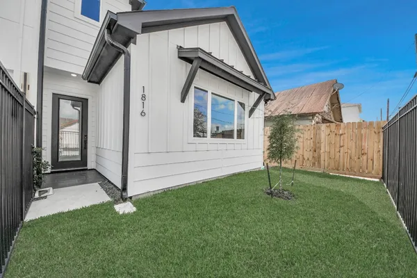 a backyard of a house with lots of green space