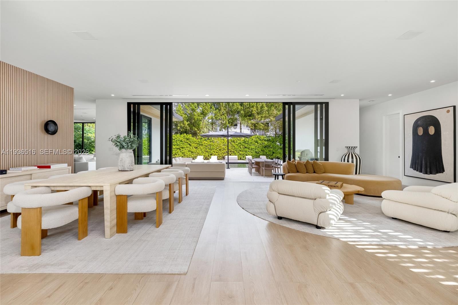 6003 Southwest 80th Street South Miami, FL 33143 - Photo 11 of 98 a living room with furniture and a large window