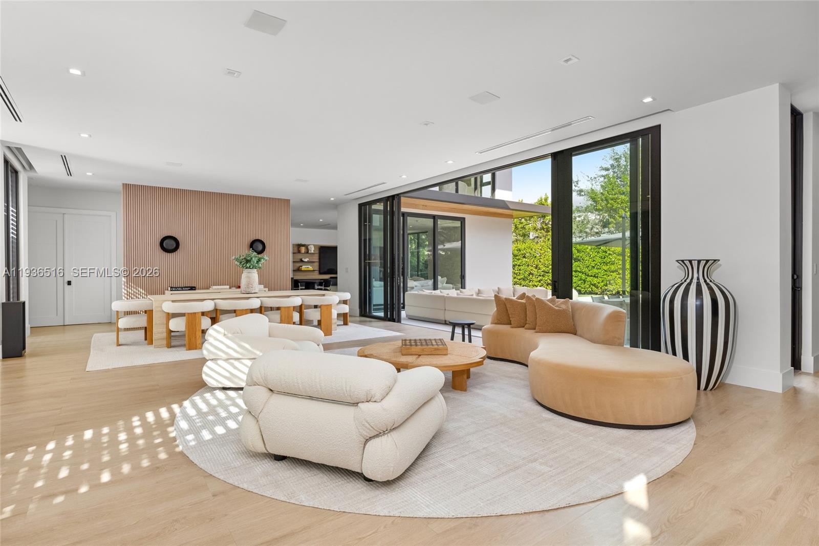 6003 Southwest 80th Street South Miami, FL 33143 - Photo 13 of 98 a living room with furniture and a large window