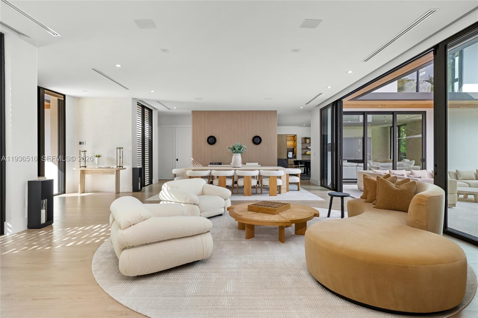 6003 Southwest 80th Street South Miami, FL 33143 - Photo 14 of 98 a living room with furniture and a large window