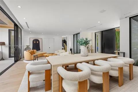 a kitchen with a table and chairs in it