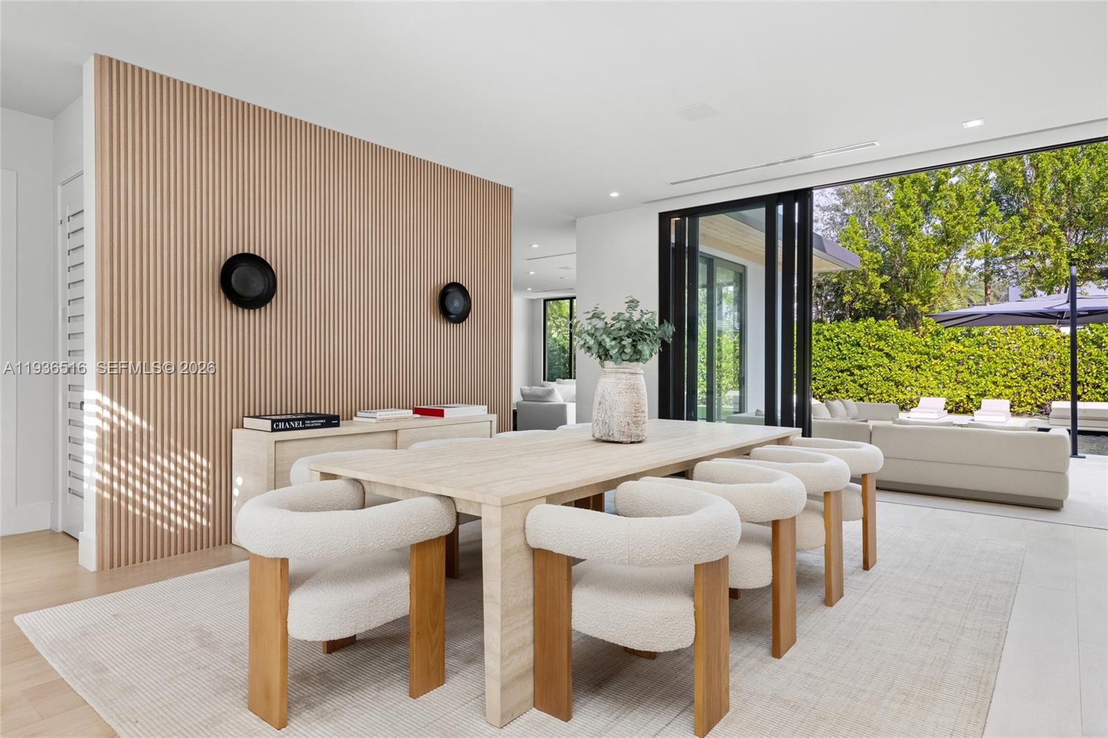 6003 Southwest 80th Street South Miami, FL 33143 - Photo 19 of 98 a view of a dining room with furniture and a large window