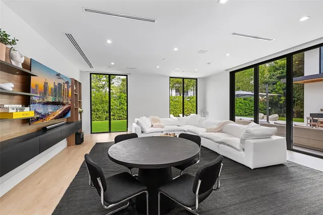 a large kitchen with stainless steel appliances granite countertop a sink and a stove top oven