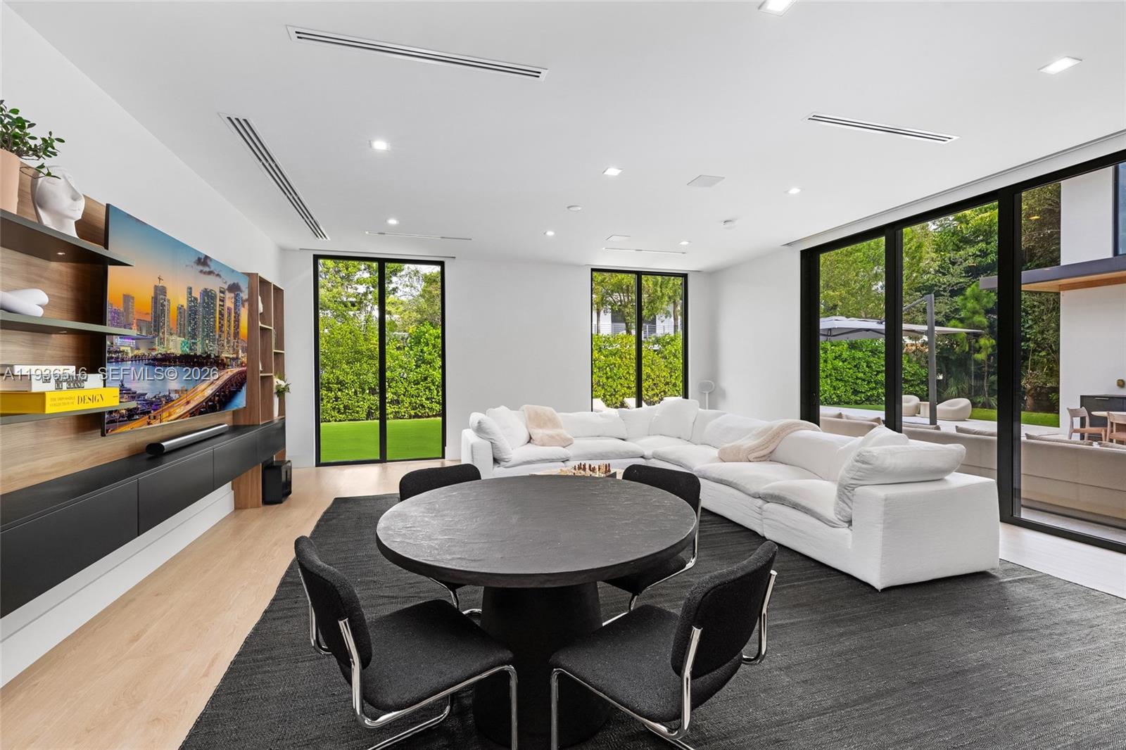 6003 Southwest 80th Street South Miami, FL 33143 - Photo 22 of 98 a living room with furniture and a table