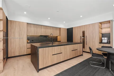 a bedroom with a large bed and a large window